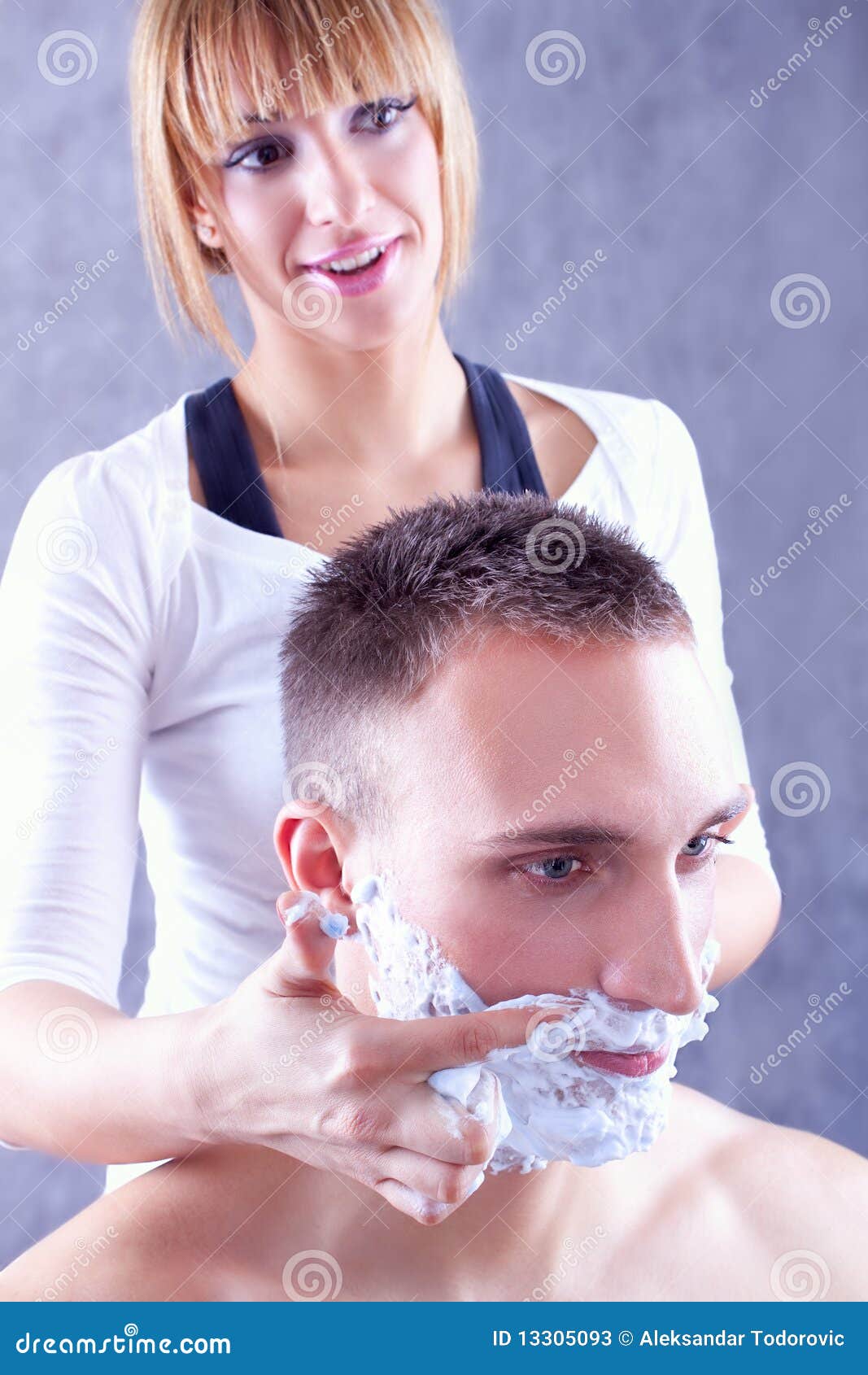 Young Woman Applying Shaving Cream On Male Face Stock Image - Image Of