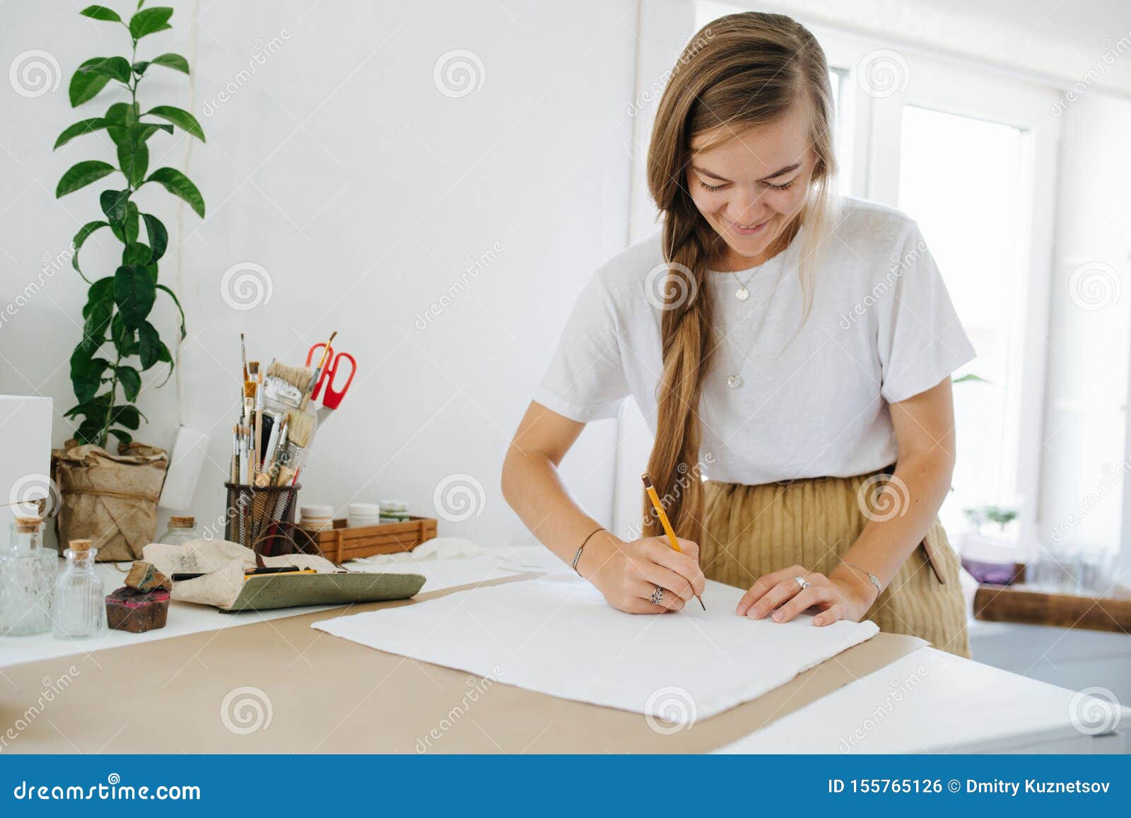Young Woman Artist Drawing on Sheet, Behind the Table at Home. Stock ...