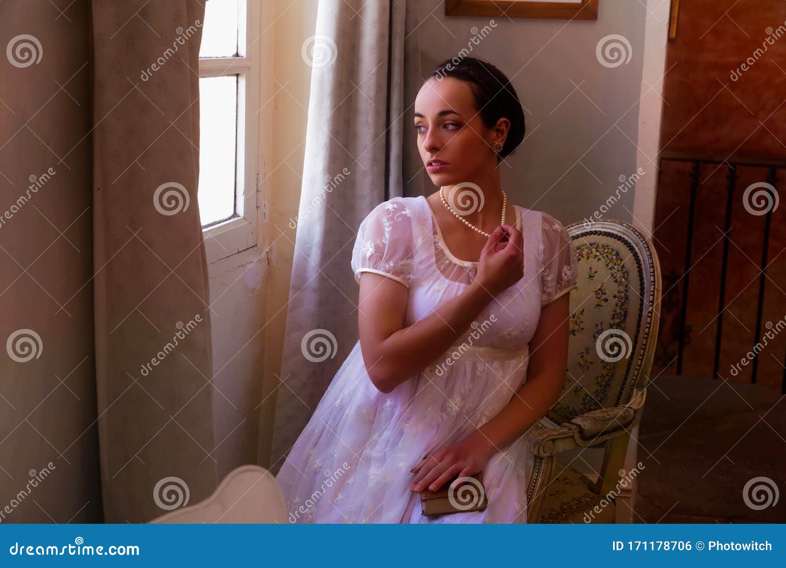 regency reenactment by young woman in lace dress