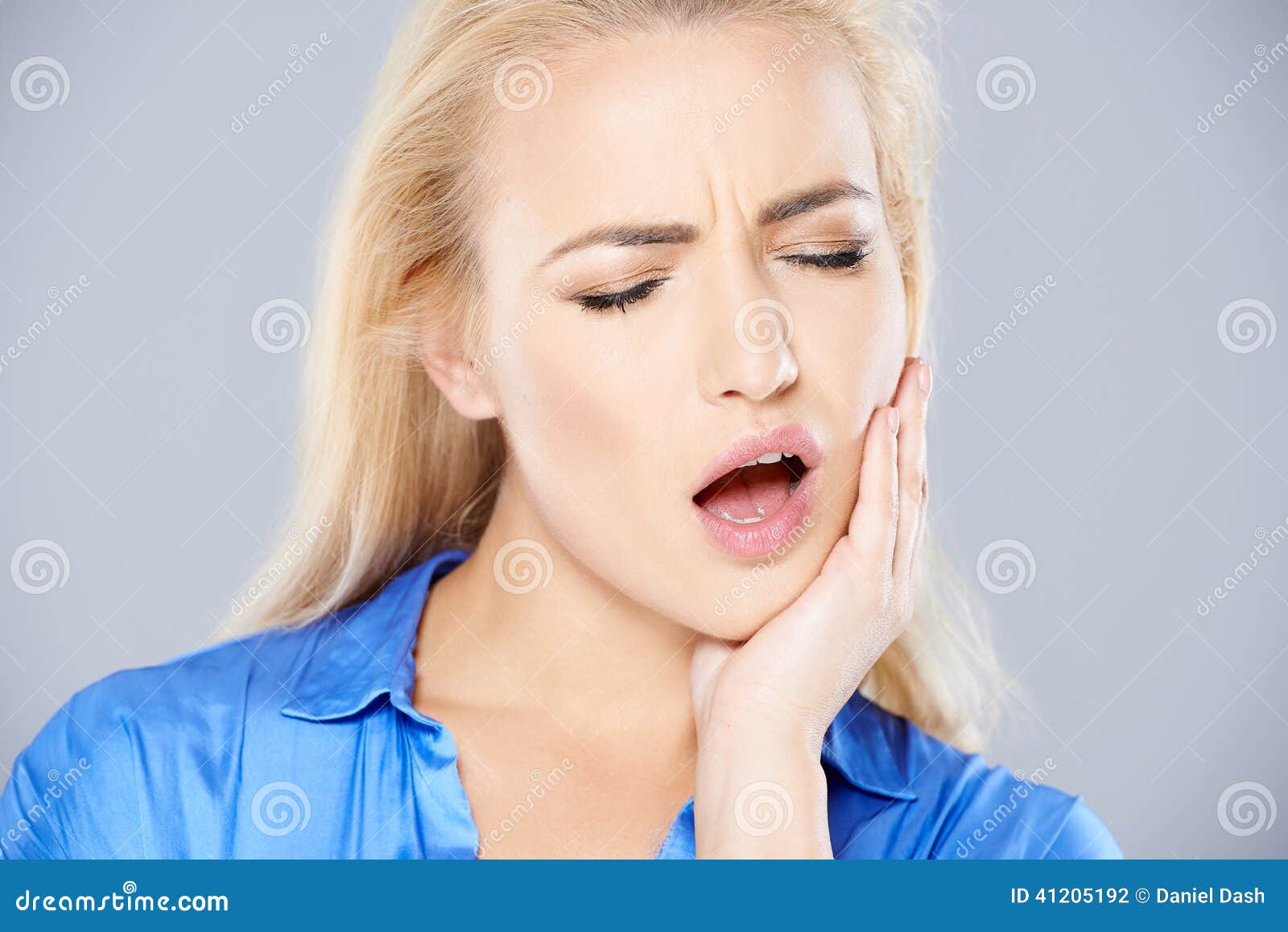 young woman with bad tooth ache