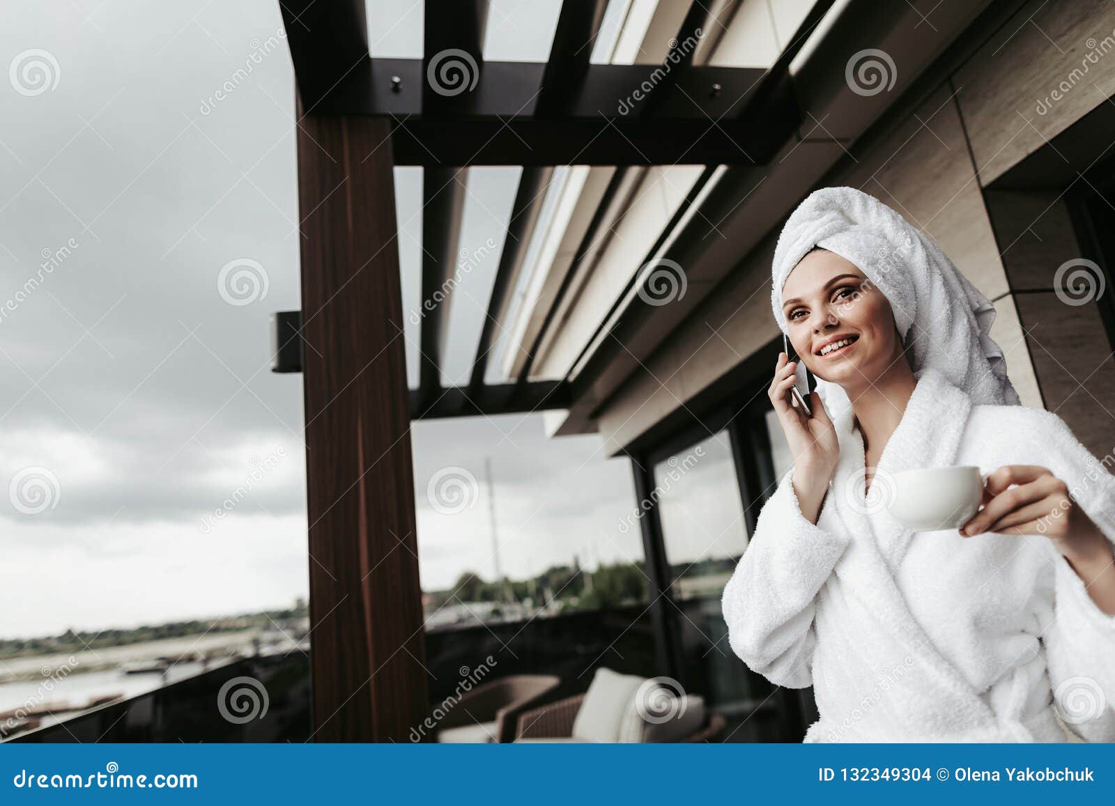 Young Woman in Bathrobe Talking by Phone Stock Photo - Image of ...