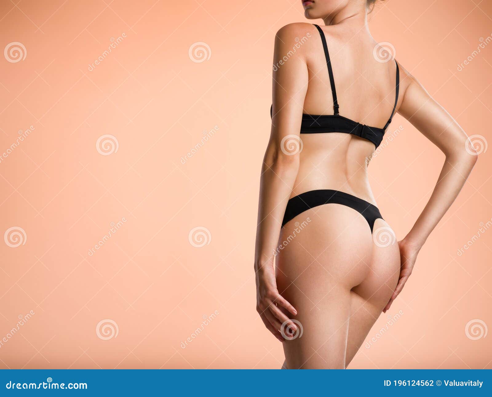 perfect slim woman body, butt in white panties closeup. Tight hips and firm  buttocks . Stock Photo