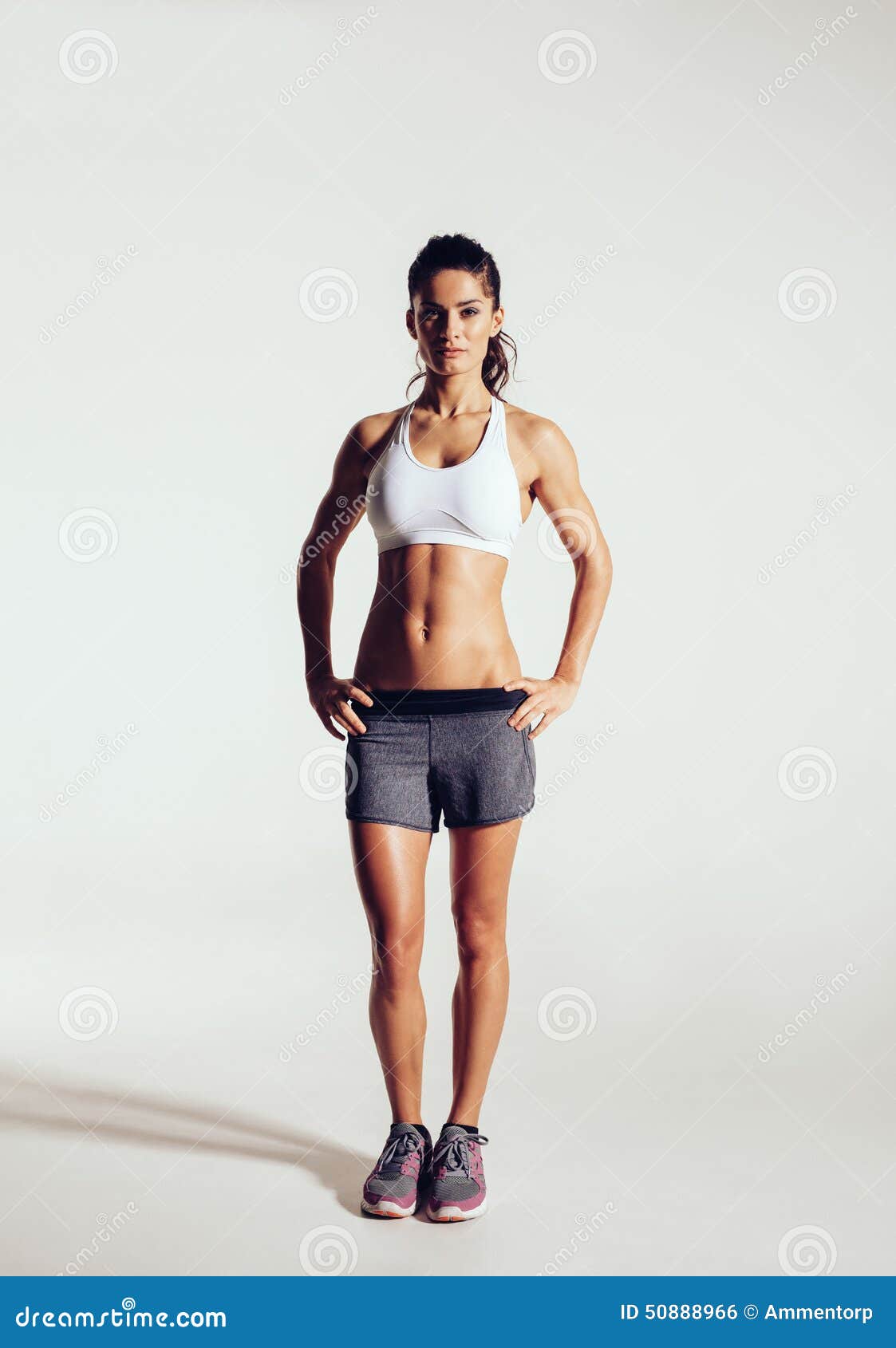 Slim and fit female athletic body stock photo containing fitness and