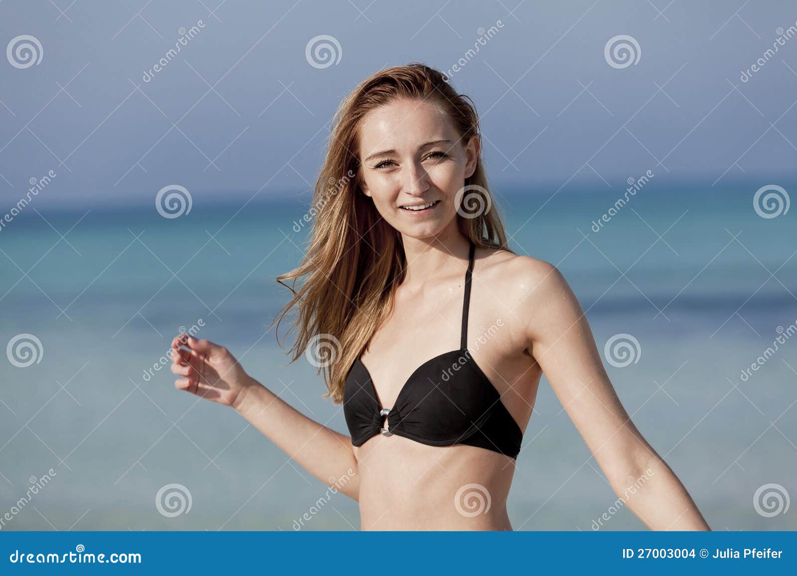 Appealing naked babes are relaxing on the beach