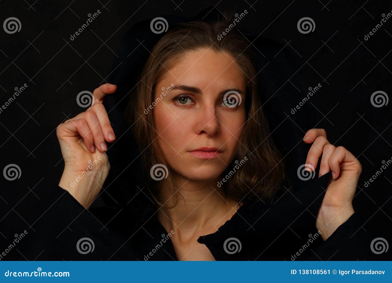 Young Woman in a Black Cloak with a Hood Stock Image - Image of ...