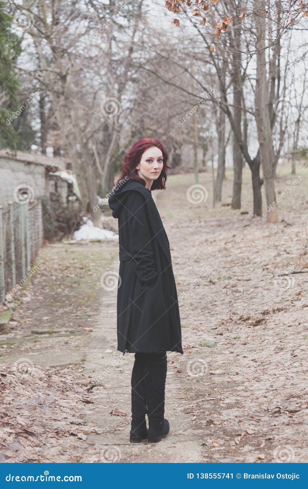 Young Woman in Black Coat Stand on Path Outdoor in Park Look Back ...