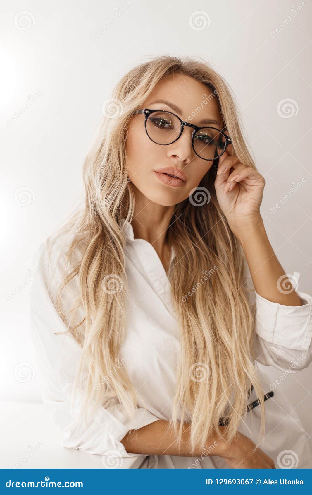 Young Woman With Blonde Hairstyle In Stylish Glasses Stock