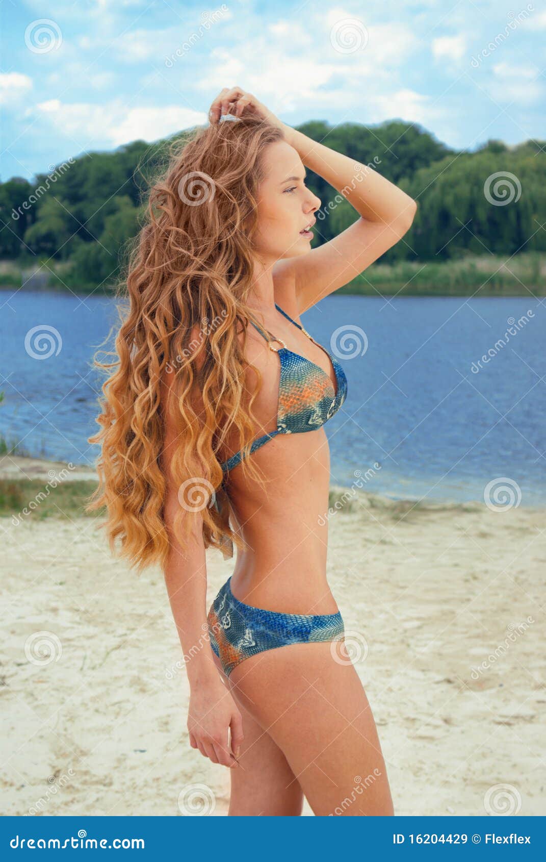 Young Girl In Bikini Doing Stretching Exercises Beside A River At Sunset  Stock Photo, Picture and Royalty Free Image. Image 22017515.