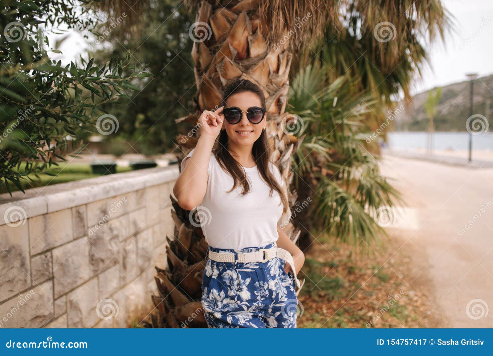 Young Woman in Blue Shorts Walk Outside Alond the Street. Tropical ...