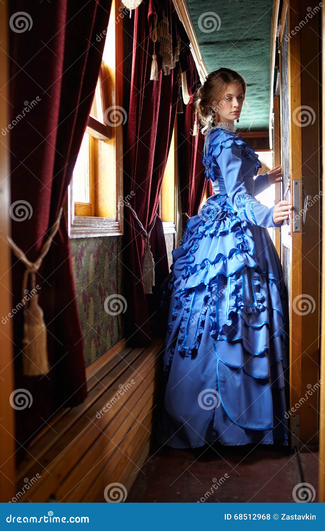 Young Woman in Blue Vintage Dress Standing in Corridor of Retro Stock ...