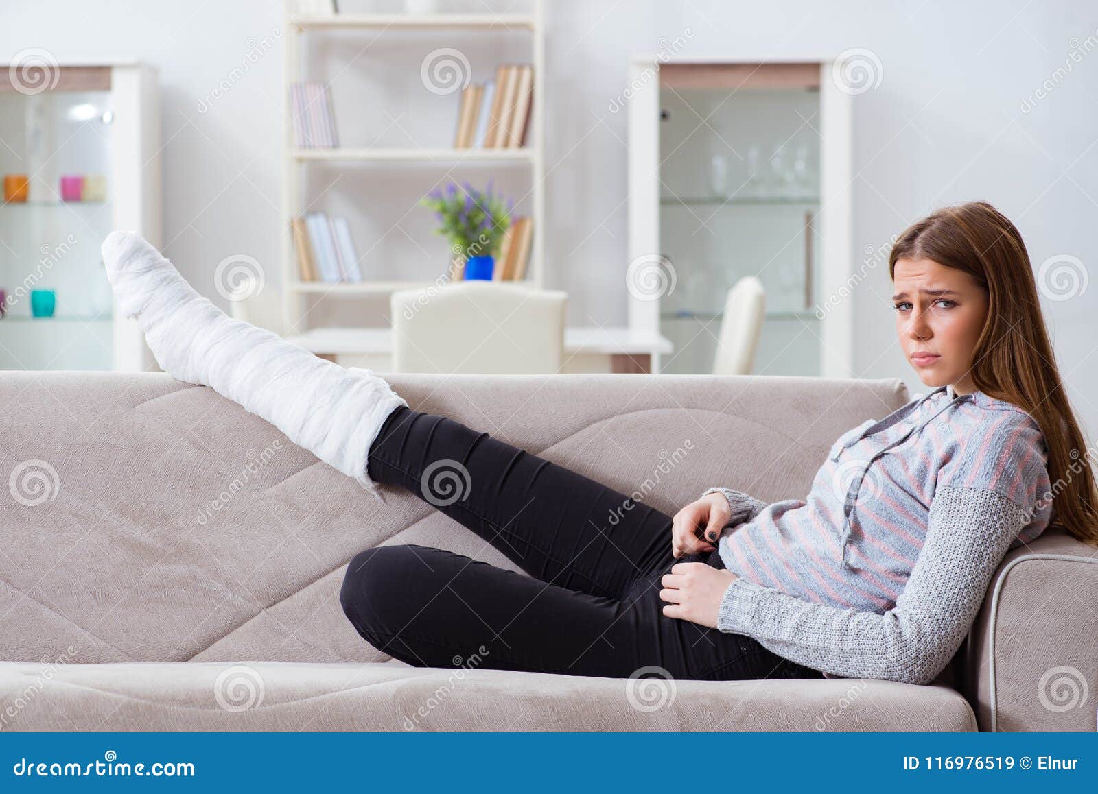 The Young Woman With Broken Leg At Home Stock Image ...