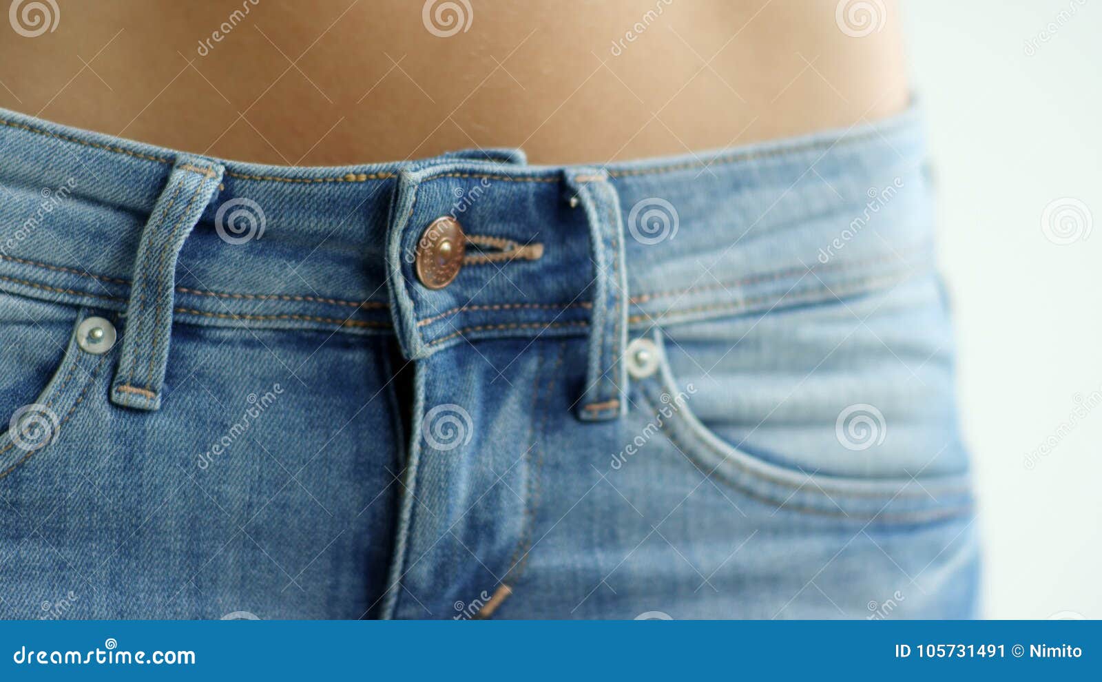 Young Woman Buttoning Blue Denim at Button on Isolated White Studio ...