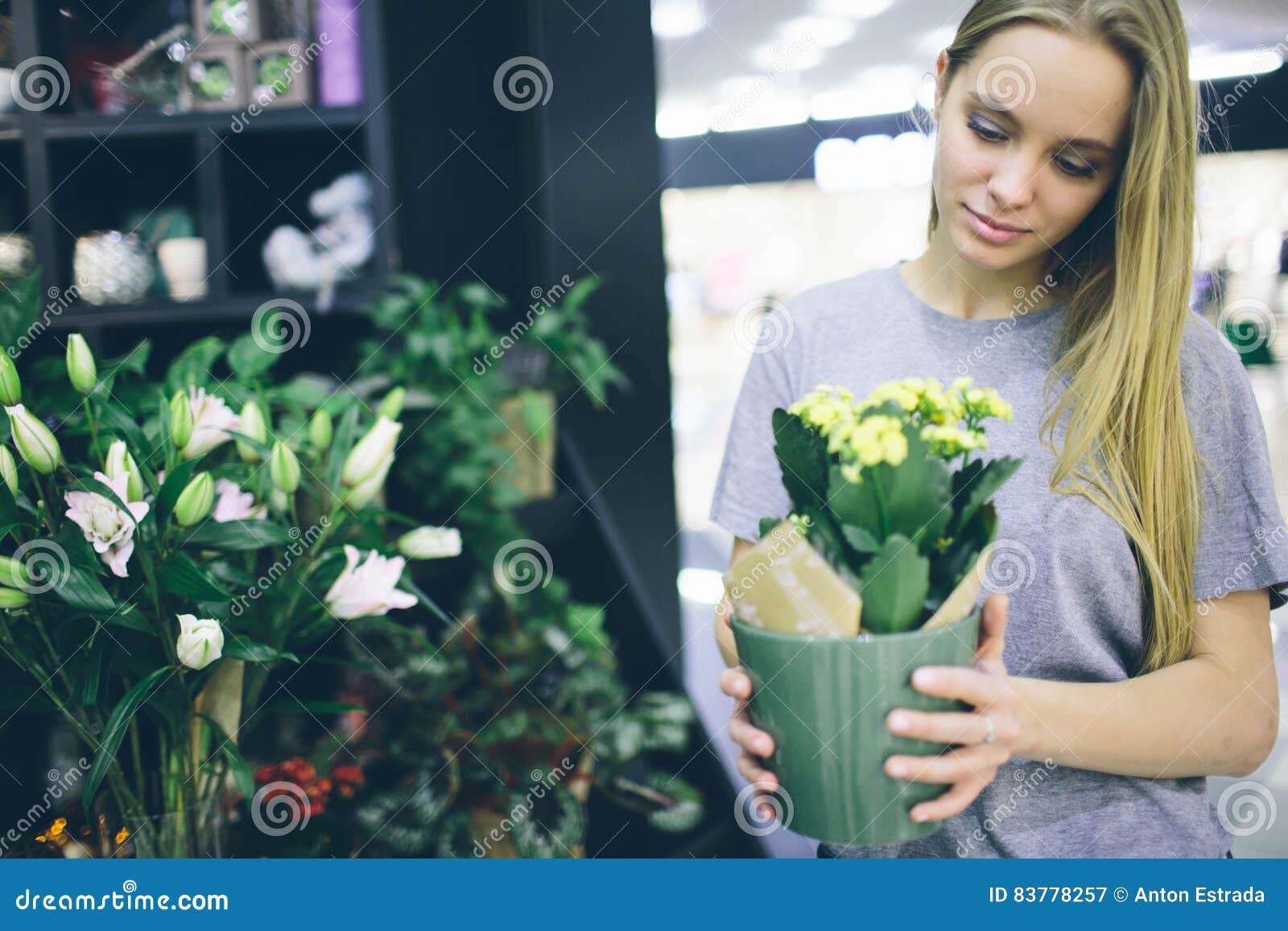 Young Woman Buying Flowers At A Garden Center Stock Image Image