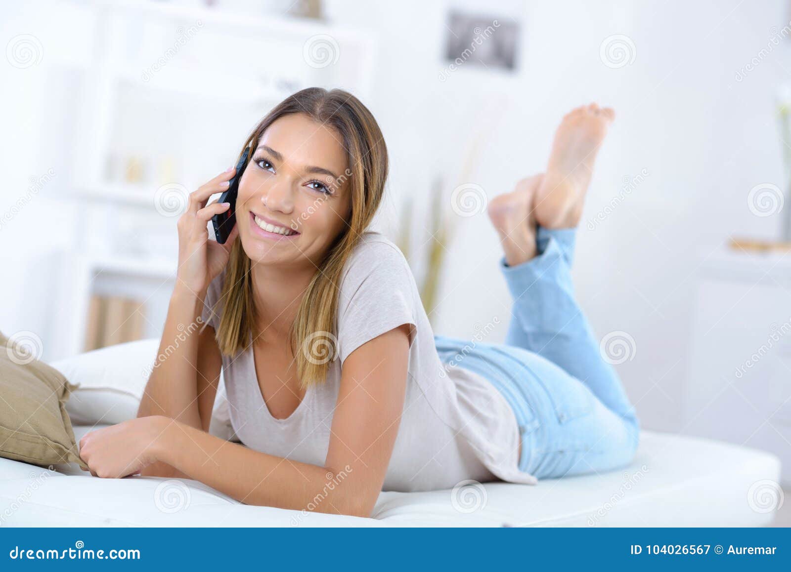 Young Woman Calling Someone on Phone Stock Image Image of pillow