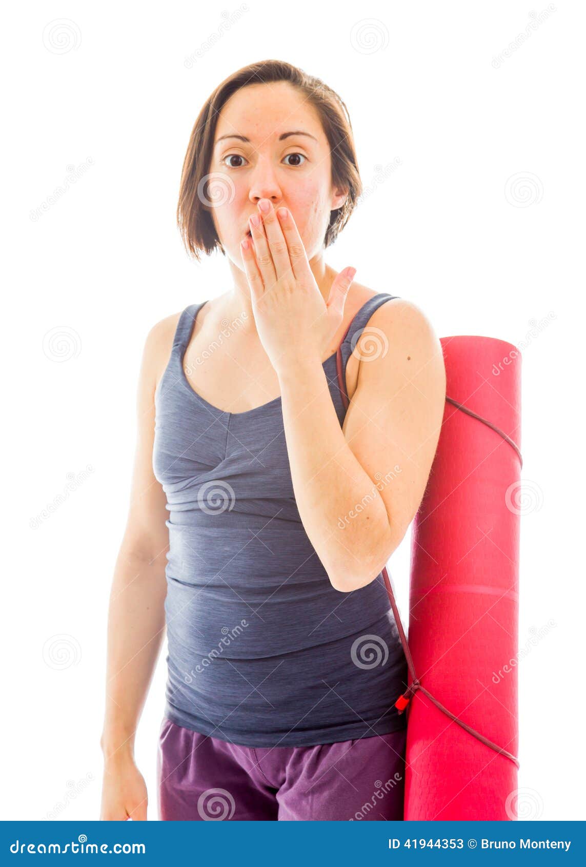 Young Woman Carrying Exercise Mat with Hand Over Her Mouth and S Stock ...