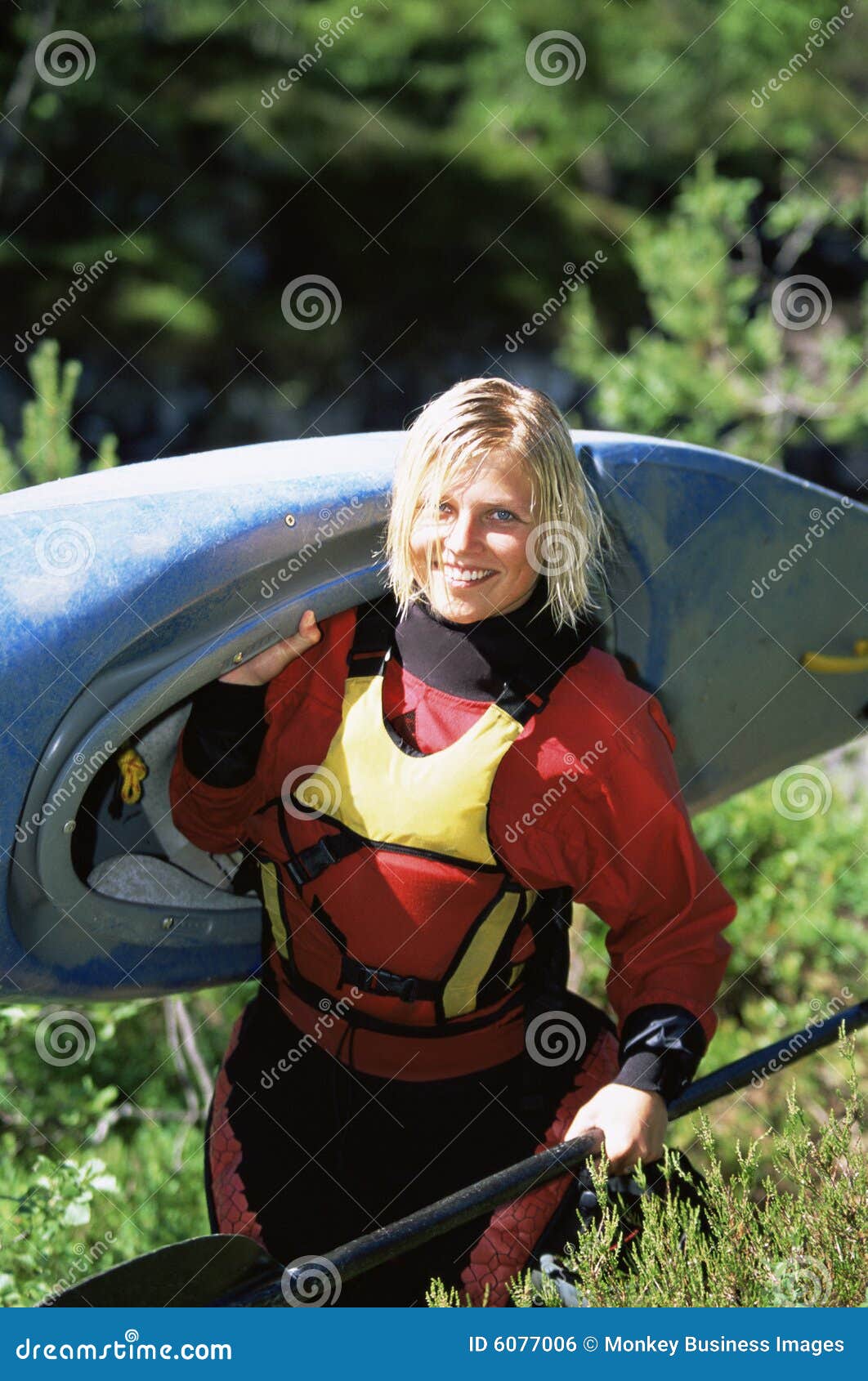 young woman carrying kayak royalty free stock image