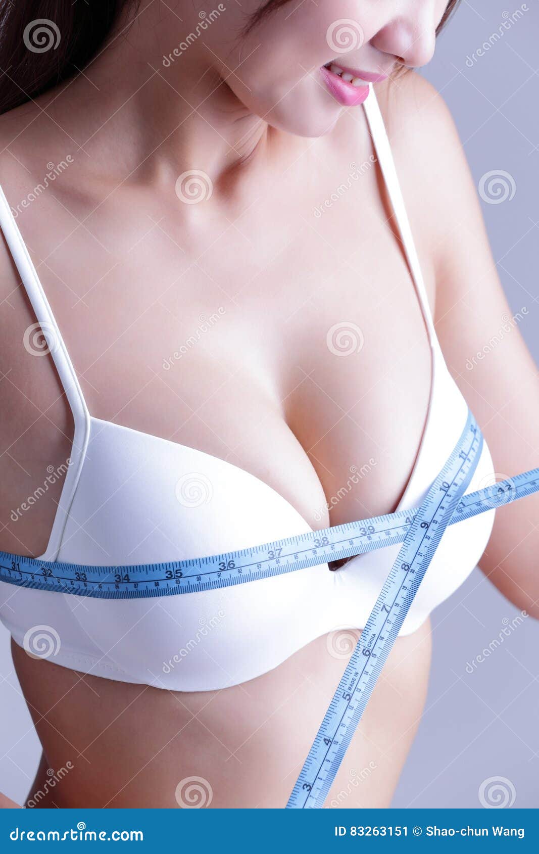 https://thumbs.dreamstime.com/z/young-woman-checking-breast-measurement-her-over-gray-background-asian-beauty-83263151.jpg