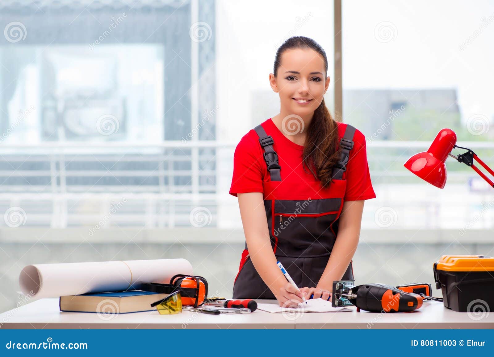 The Young Woman in Coveralls Doing Repairs Stock Image - Image of ...