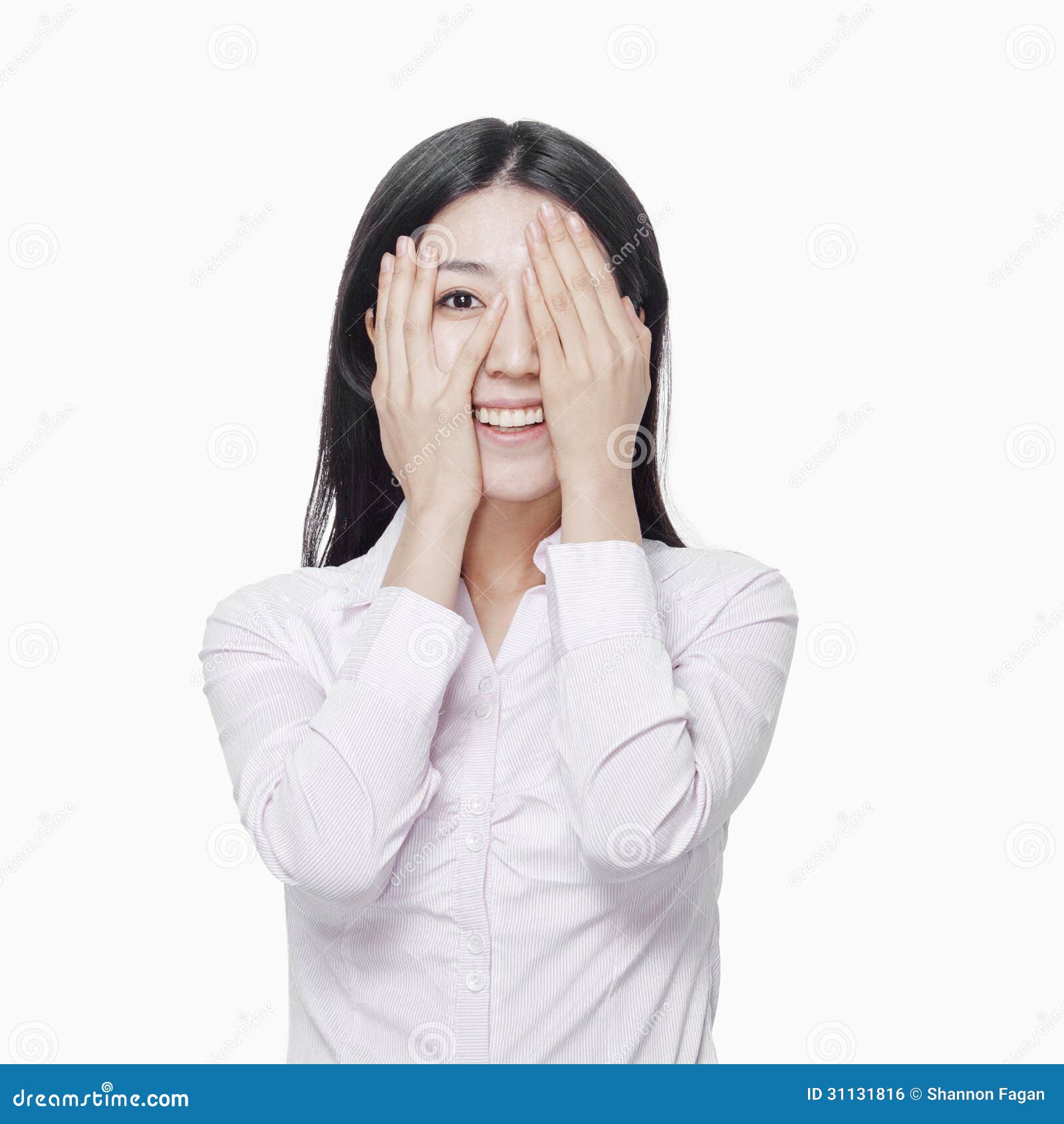 Young Woman Covering Eyes with Hands, Studio Shot Stock Photo Image