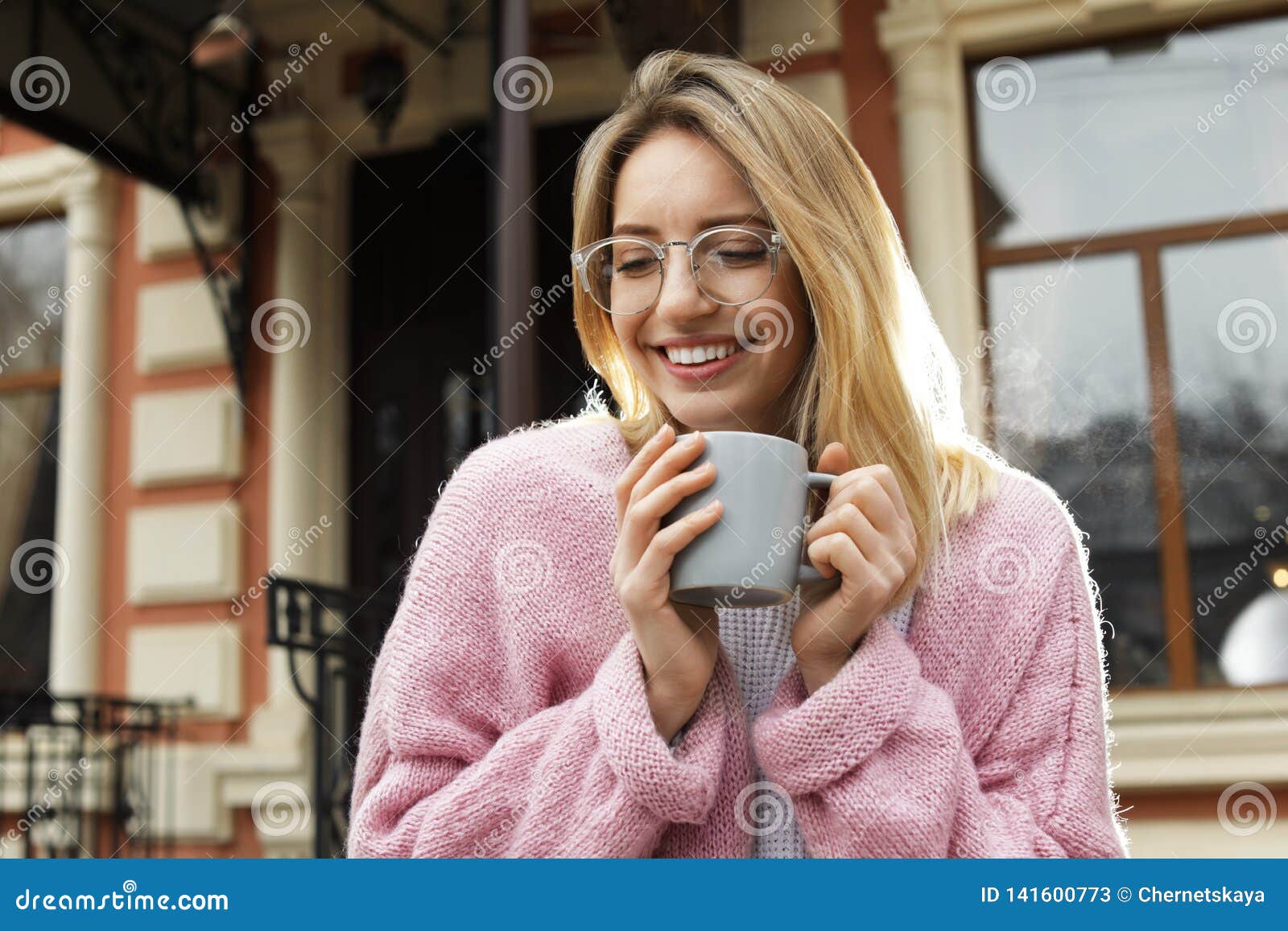 Young Woman with Cup of Hot Drink Stock Image - Image of adult, clothes