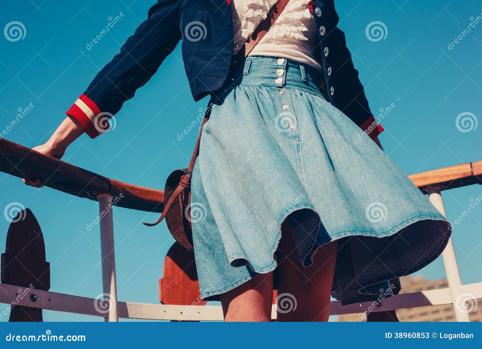 Young Woman On Deck Of Ship With Skirt Blowing Stock Image 