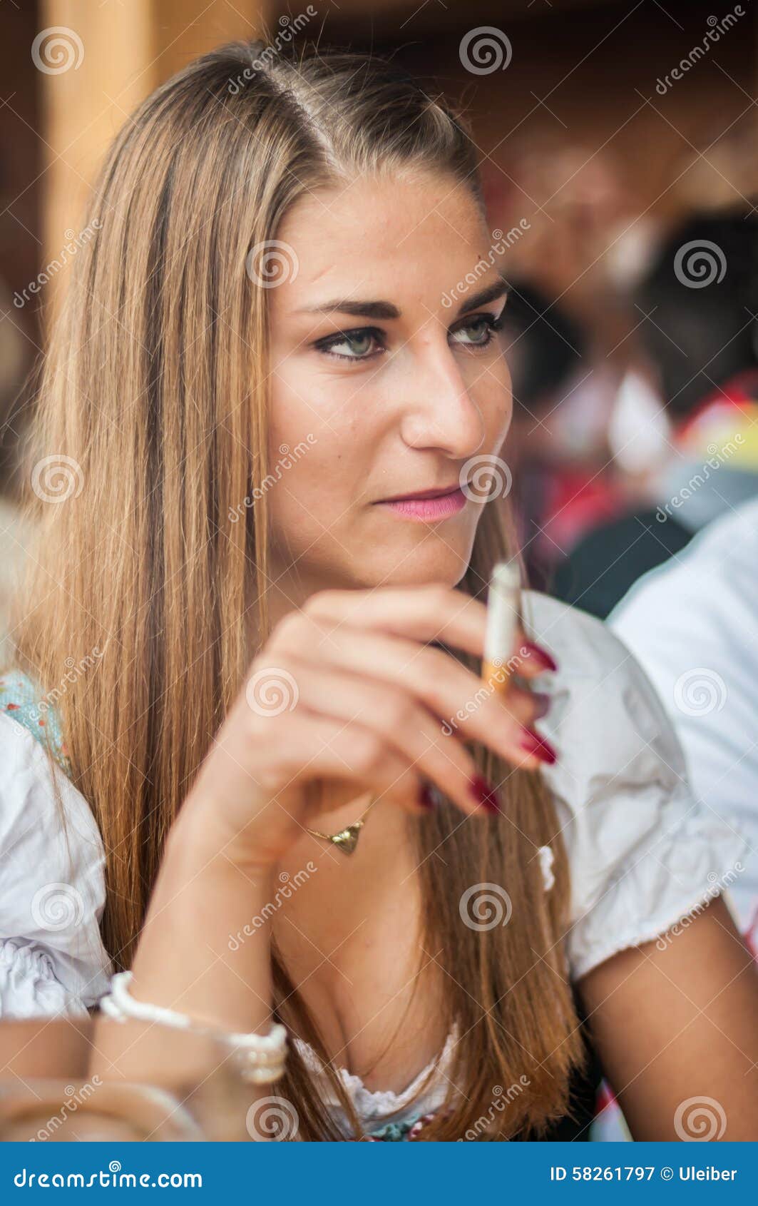 Young Woman In Dirndl Dress Sitting And Smoking At Stock Image Image Of Bavarian Traditional 58261797
