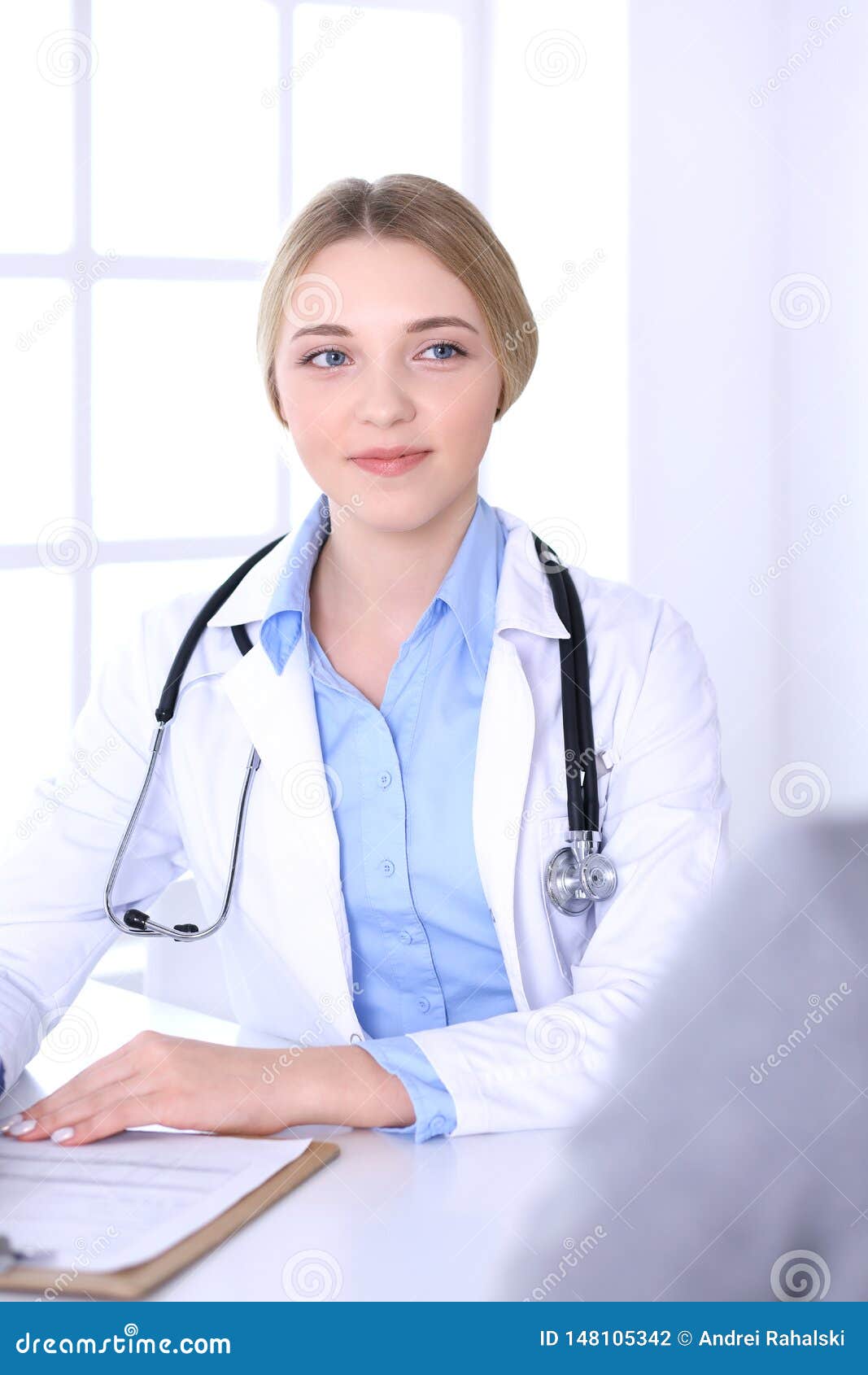 Young Woman Doctor and Patient at Medical Examination at Hospital ...