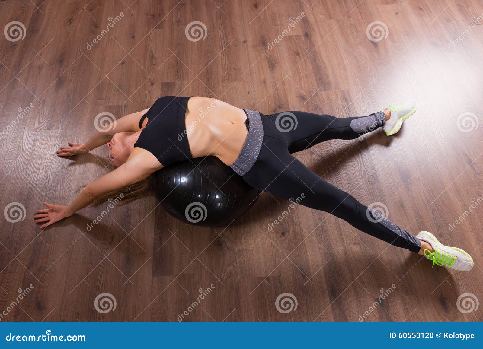 Young Woman Doing Back Bend Over Exercise Ball Stock Photo - Image of