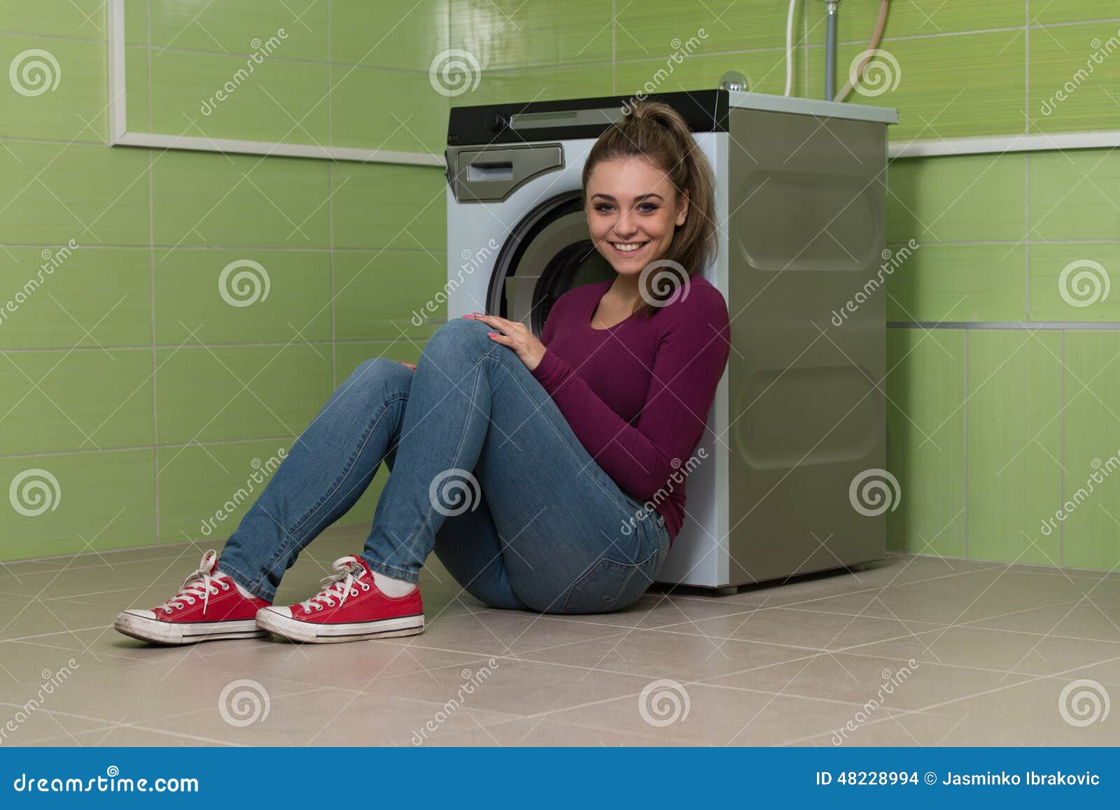 young woman doing housework laundry