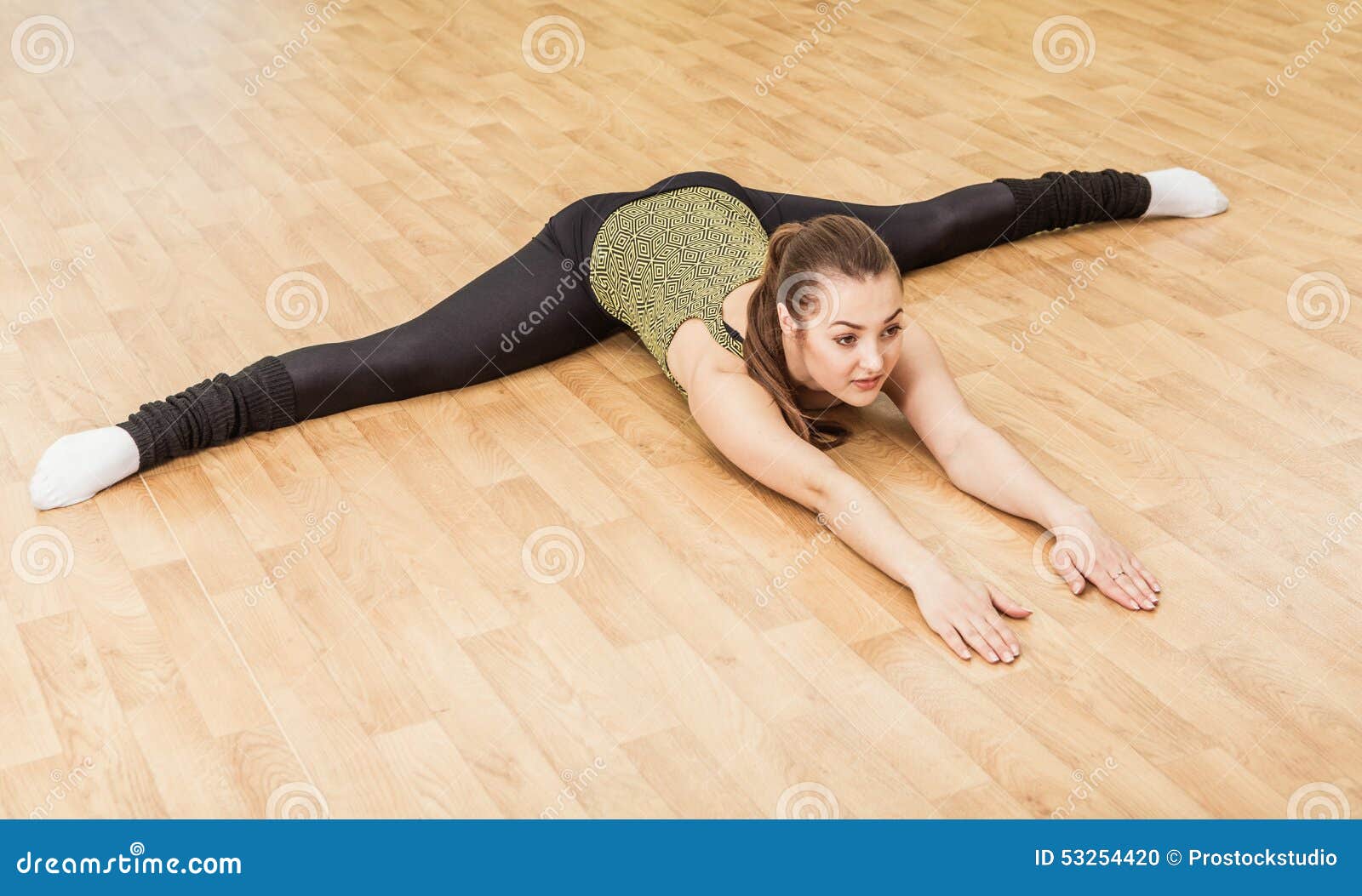 Young Woman Doing Side Split in Fitness Class Stock Photo - Image