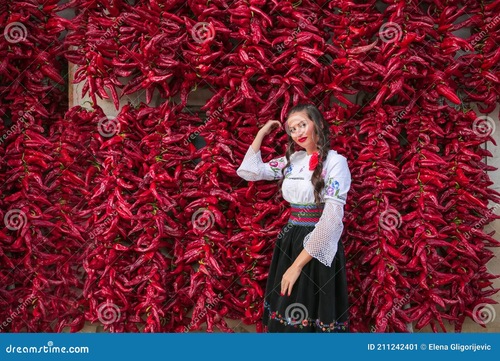 Young Woman Dressed On Traditional Serbian Balkan Clothing National Folk Costumeposing Near Of