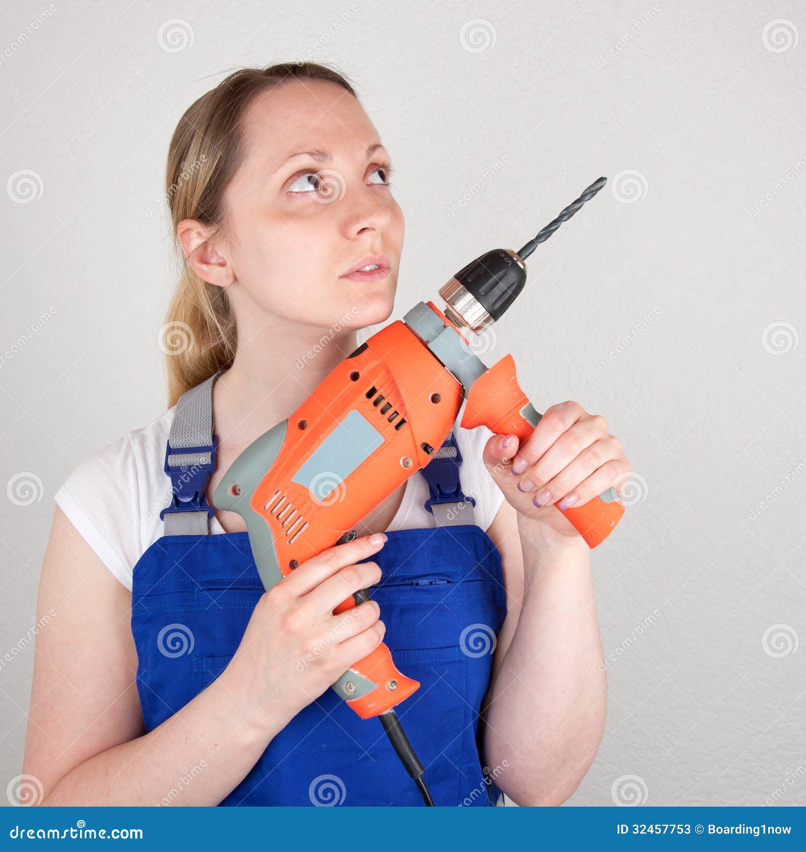 Young Woman with Drilling Machine in Her Hands Stock Image Image of