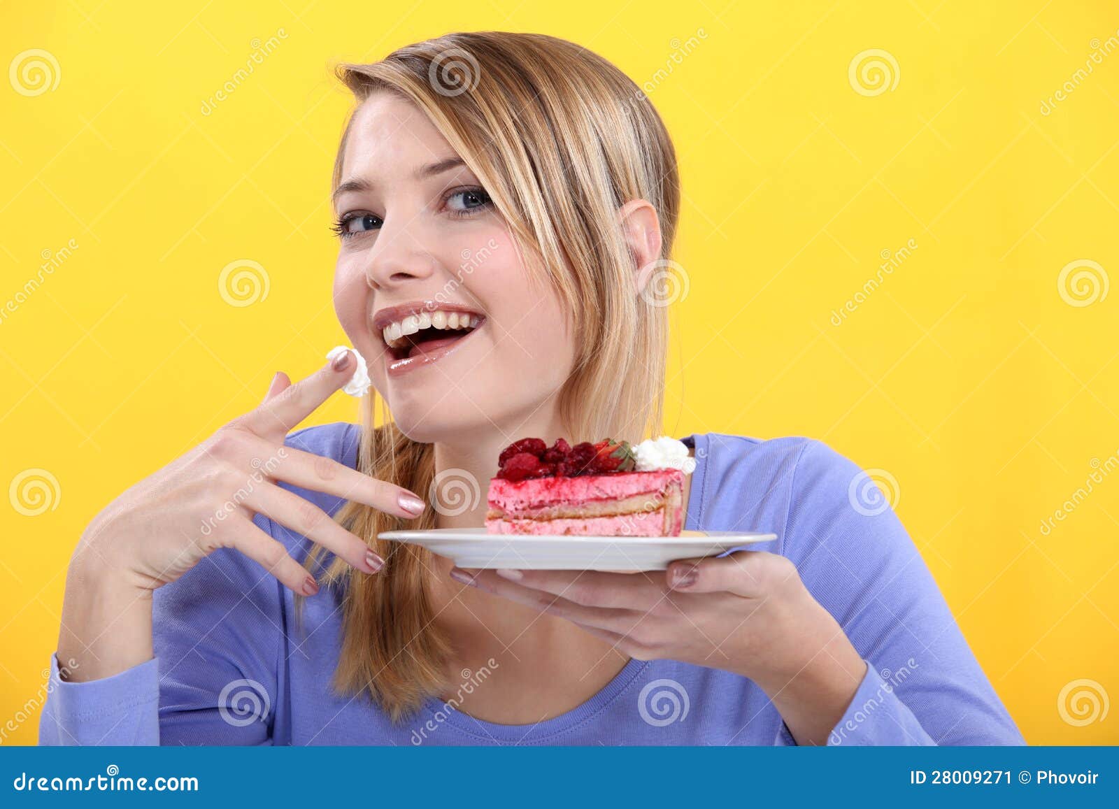 Young woman eating cake stock image. Image of cheerful 28009271