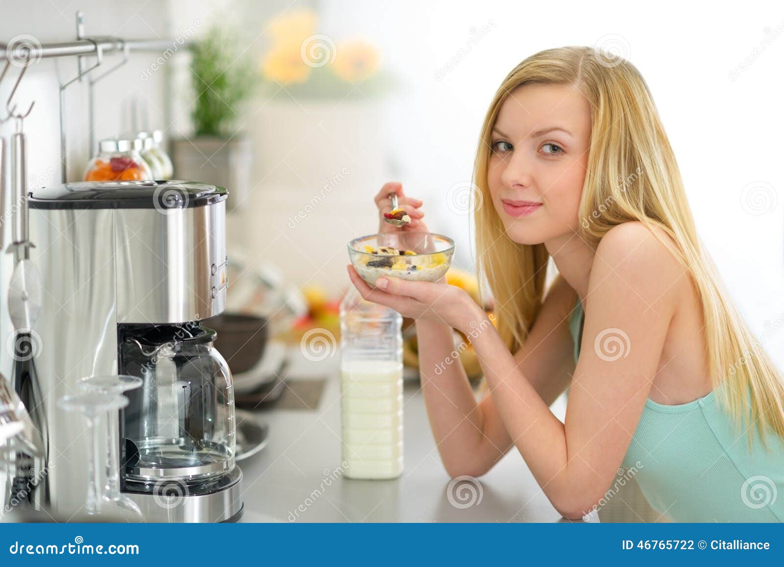 Young Woman Eating Muesli in Kitchen Stock Photo Image of lifestyle, meal 46765722