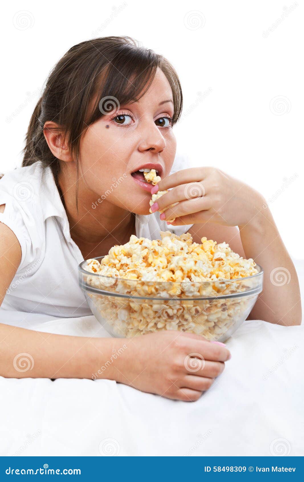 Young woman eating popcorn stock image. Image of smile 58498309