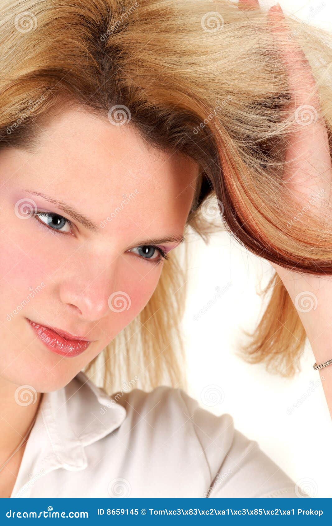 Young Woman is Editing Her Hairstyle Stock Image - Image of looking