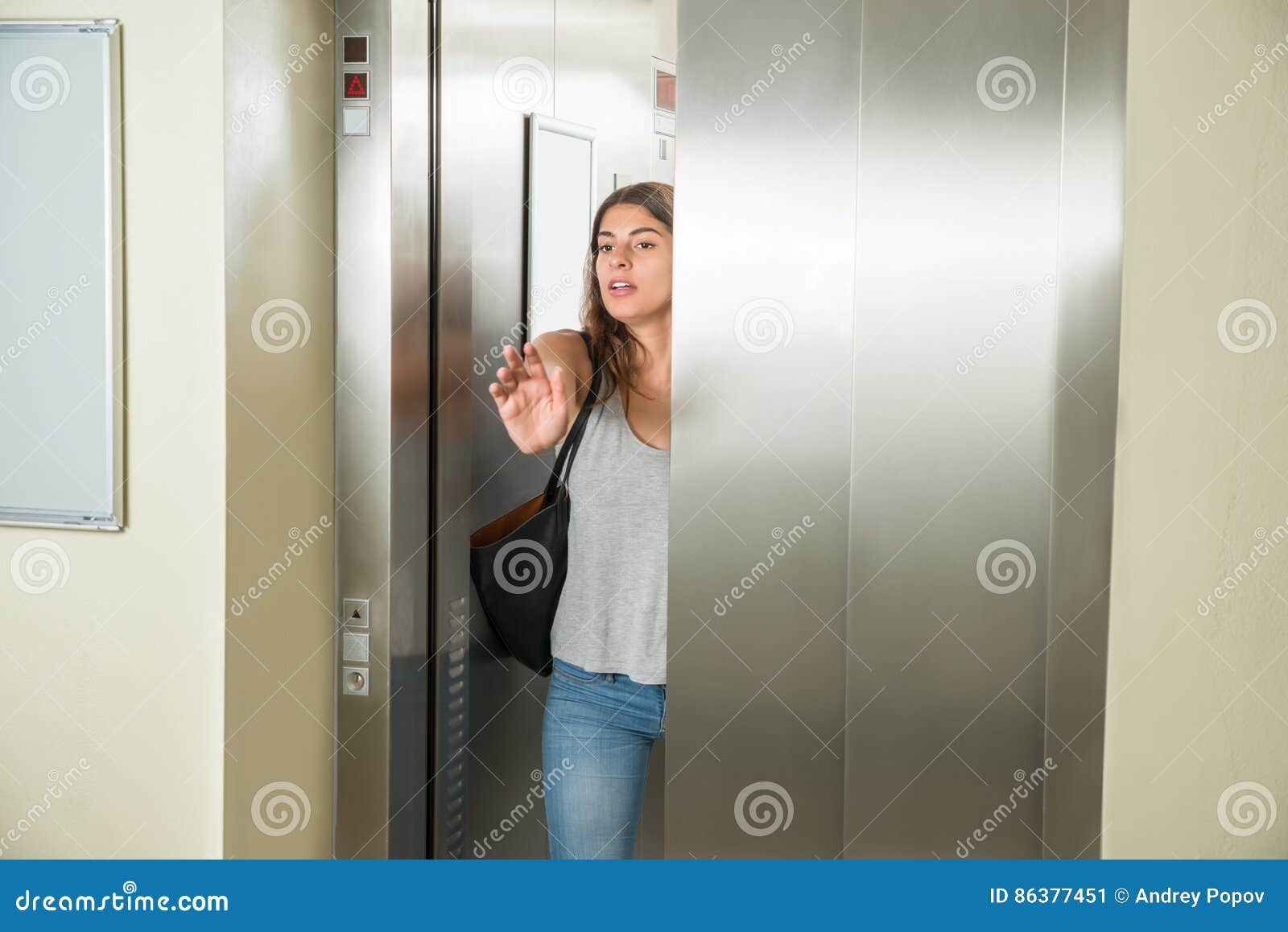 Young Woman in Elevator stock image. Image of level, construction 86377451