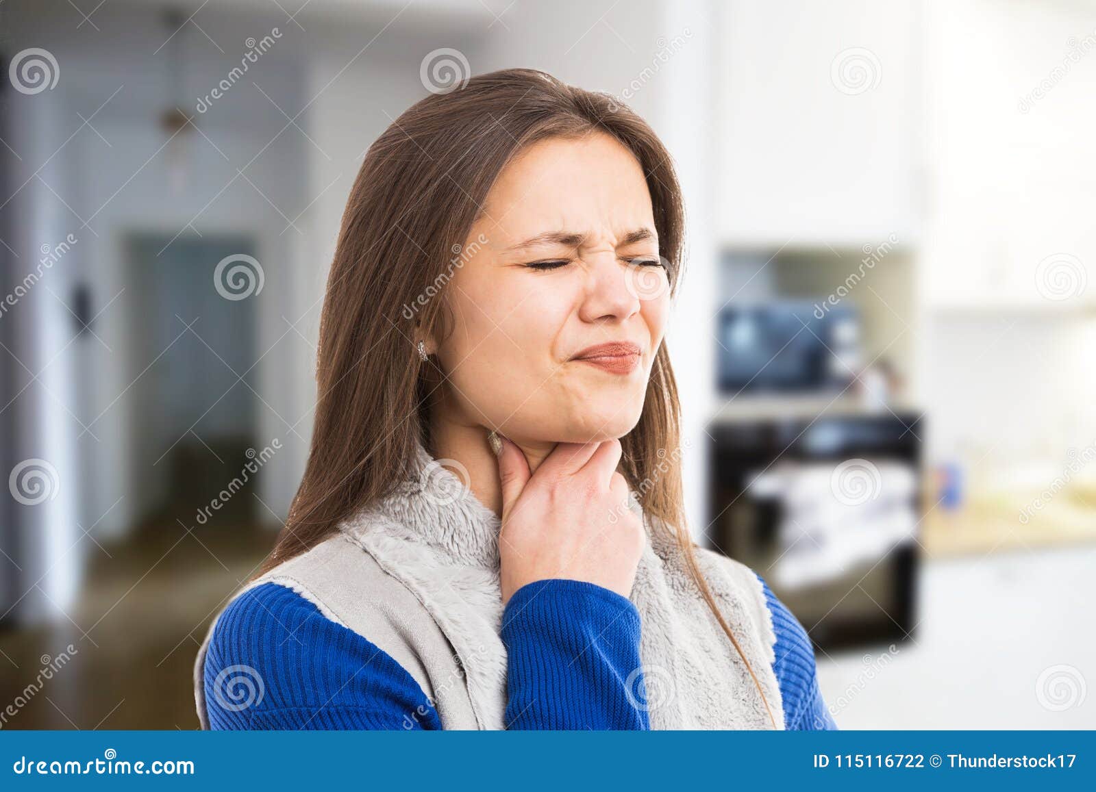 young woman experiencing throat ache