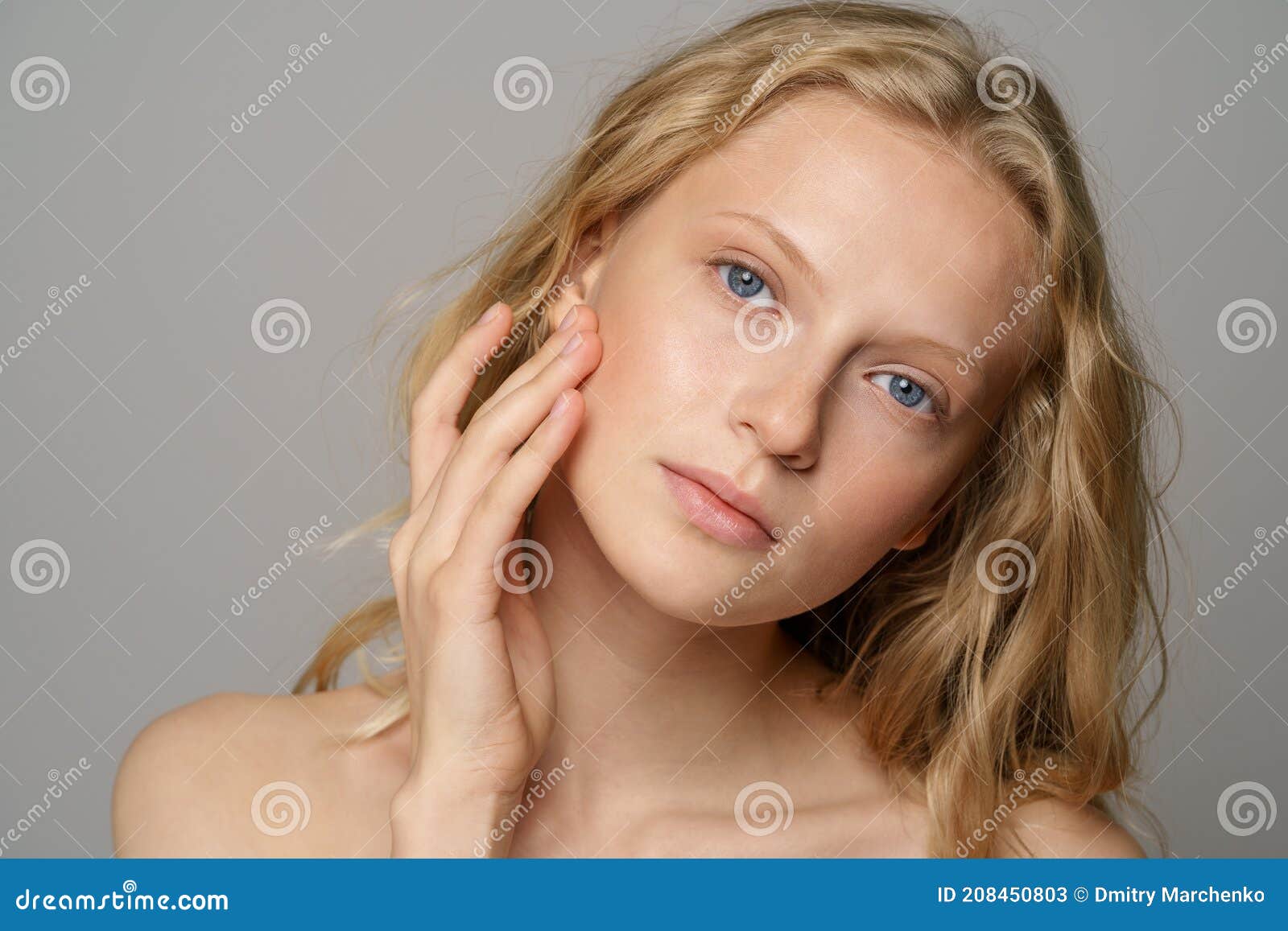 Young Woman Face with Blue Eyes Curly Natural Blonde Hair Has No Makeup  Touching Her Soft Skin Stock Image - Image of bright, amazing: 208450803