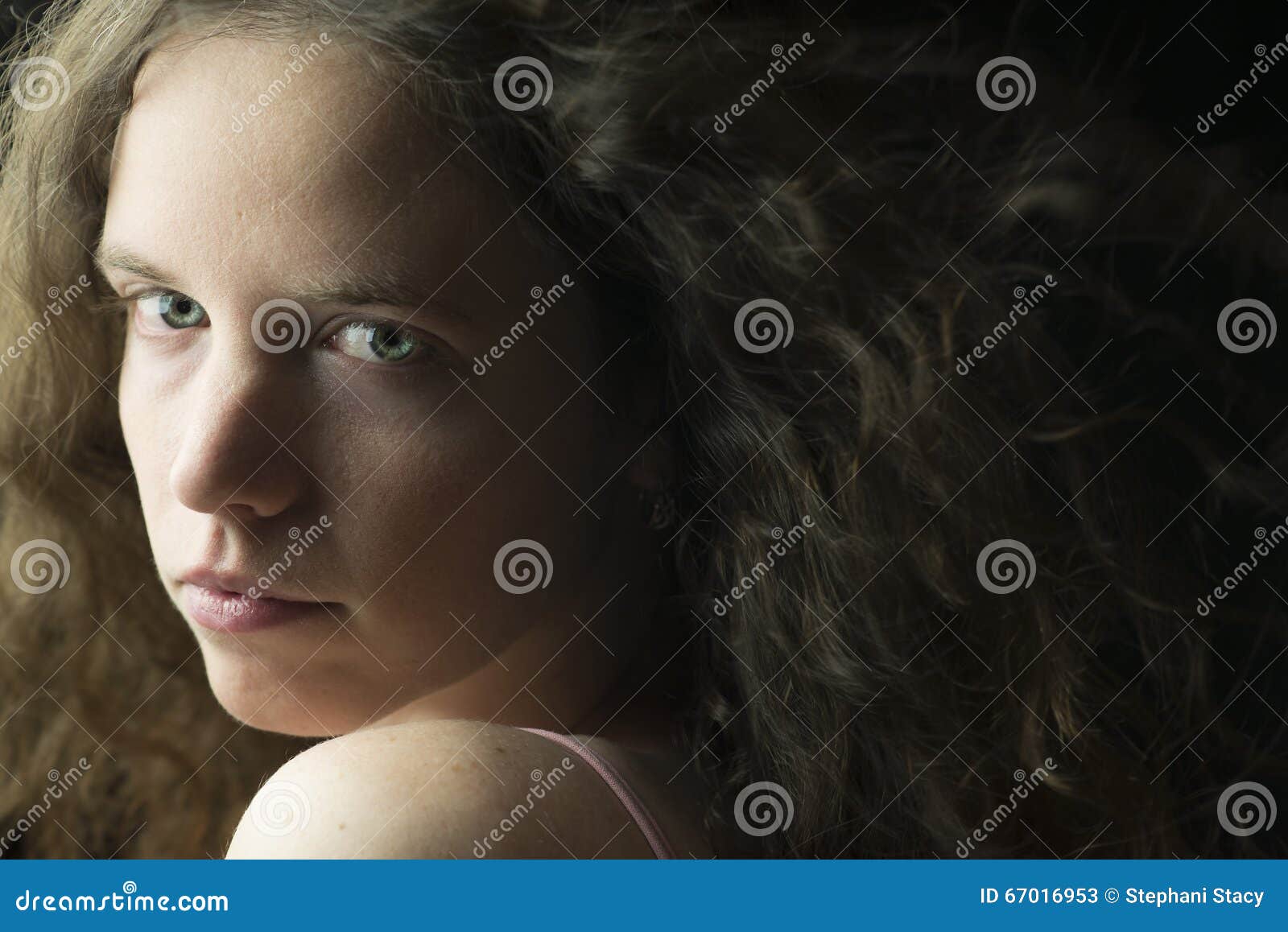 Young Woman With Fair Skin Blue Eyes And Light Brown Curly