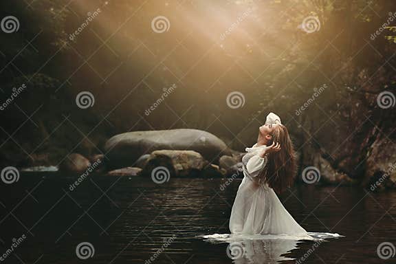 Young woman in fairy pond stock photo. Image of lonely - 90462960