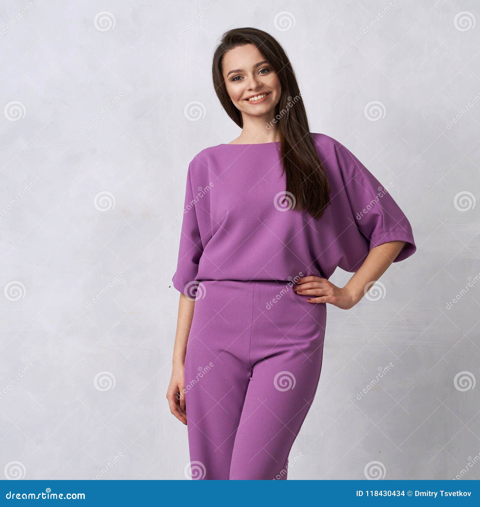 Young Woman in Fashionable Purple Jumpsuit Stock Photo - Image of ...