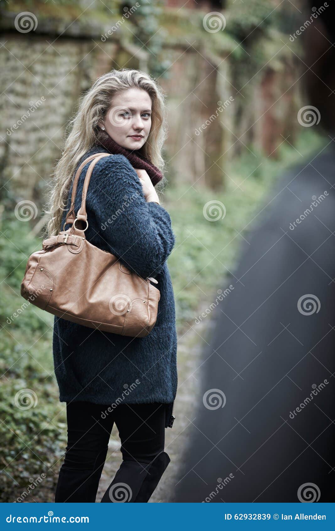 young woman feeling threatened as she walks home