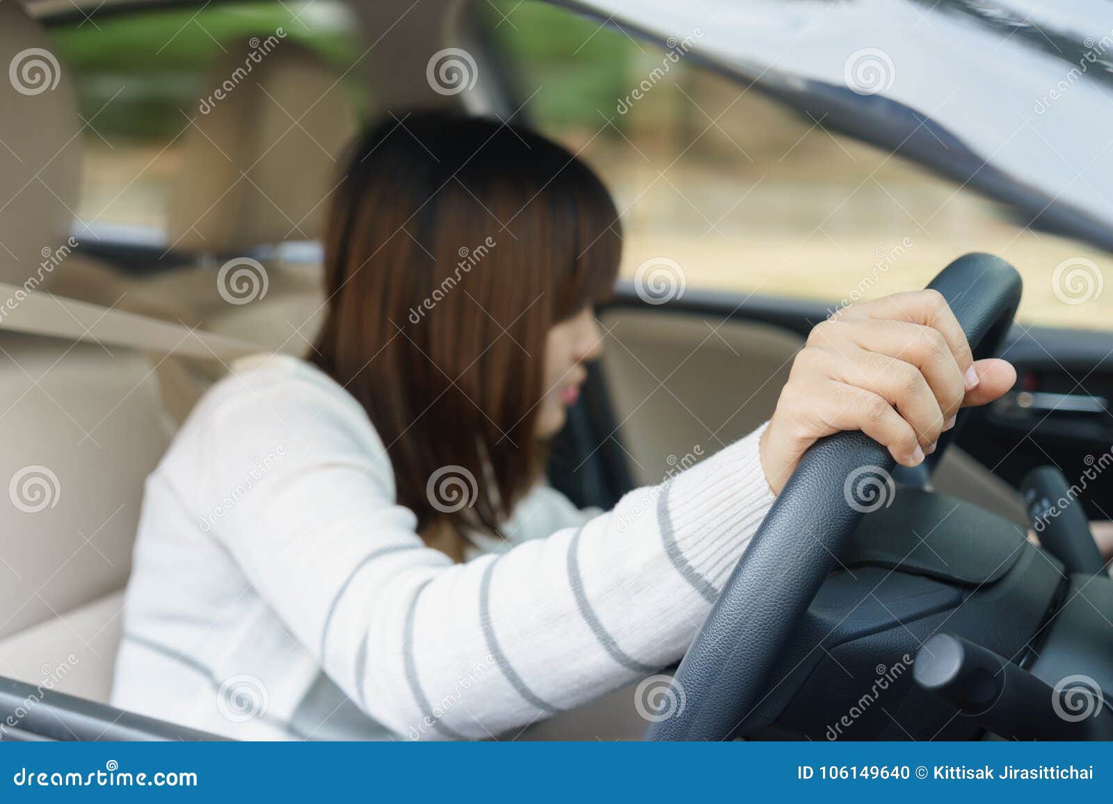 Young Woman Find Something in Drawer Front of Car with Carelessness