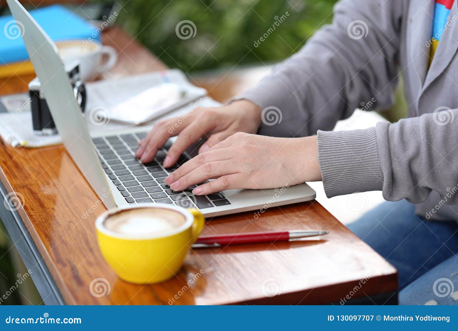 young woman of freelancer working using laptop computer in coffee shop, communication technology and business concept