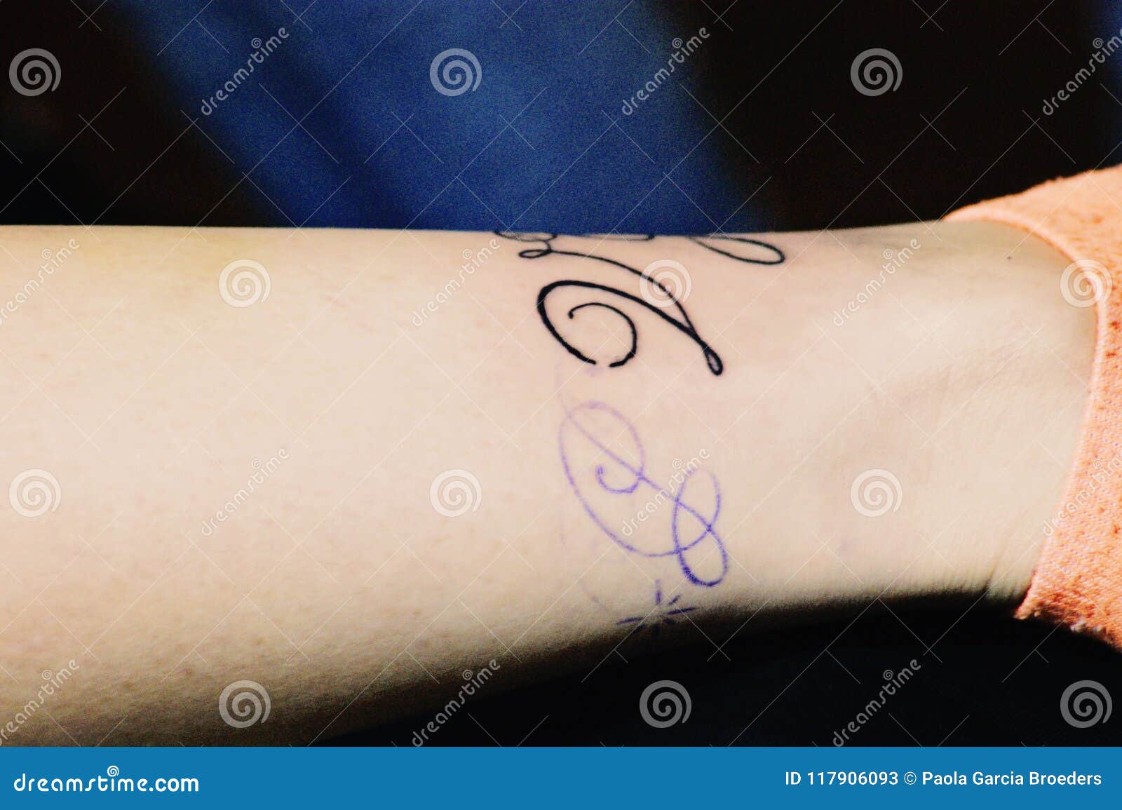 A Woman Getting a Script Tattoo Stock Image - Image of lying, print: 117906093 A Woman Getting a Script Tattoo Stock Image - Image of lying, print: 117906093
