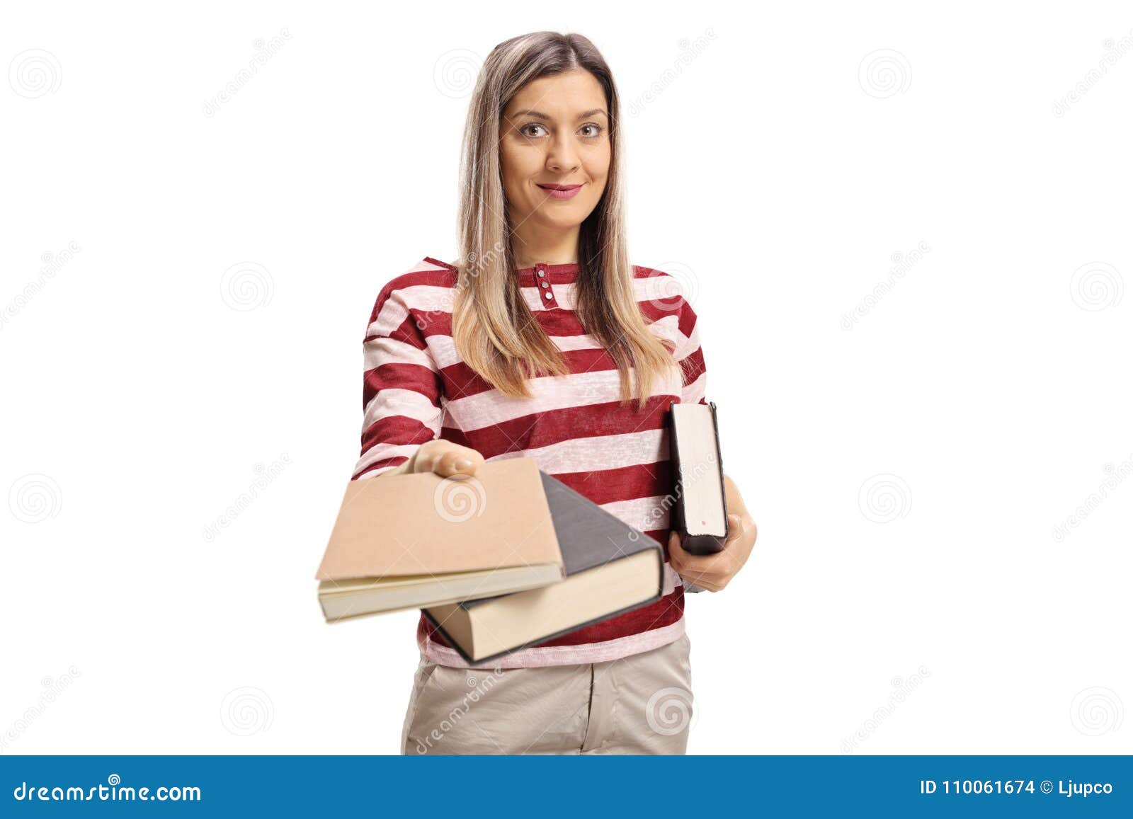 Young woman giving books isolated on white background