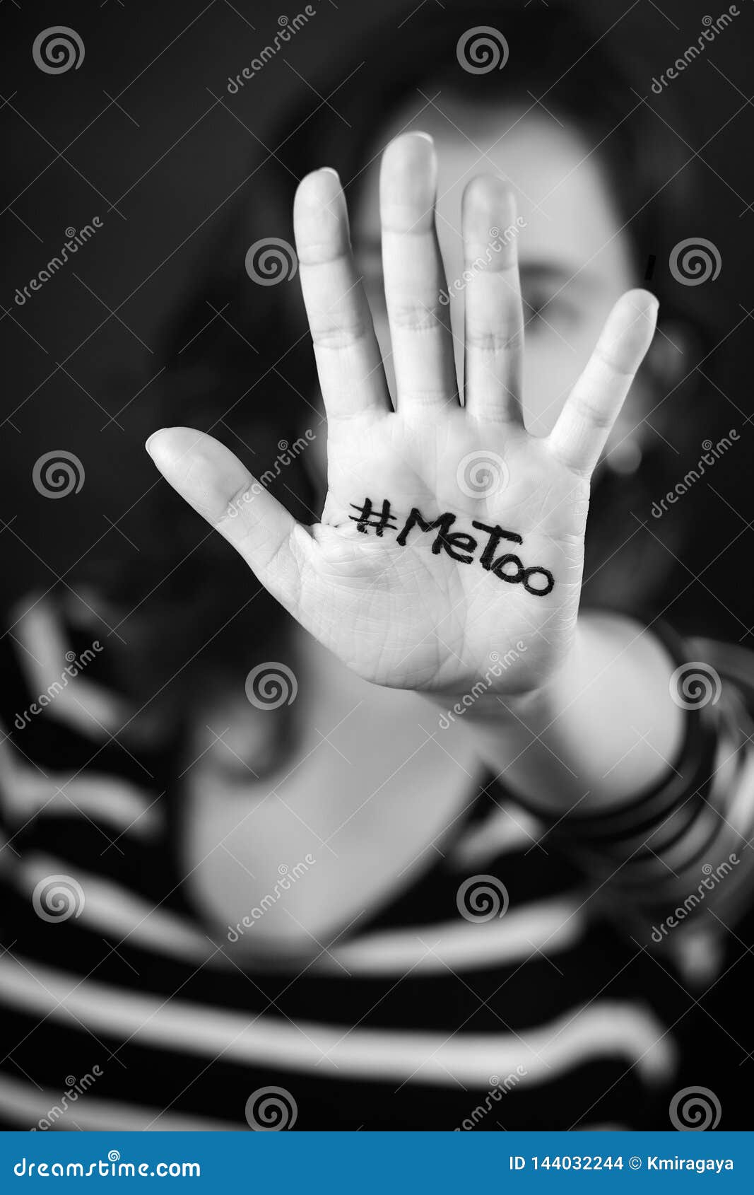 young woman with the hashtag metoo written on her hand