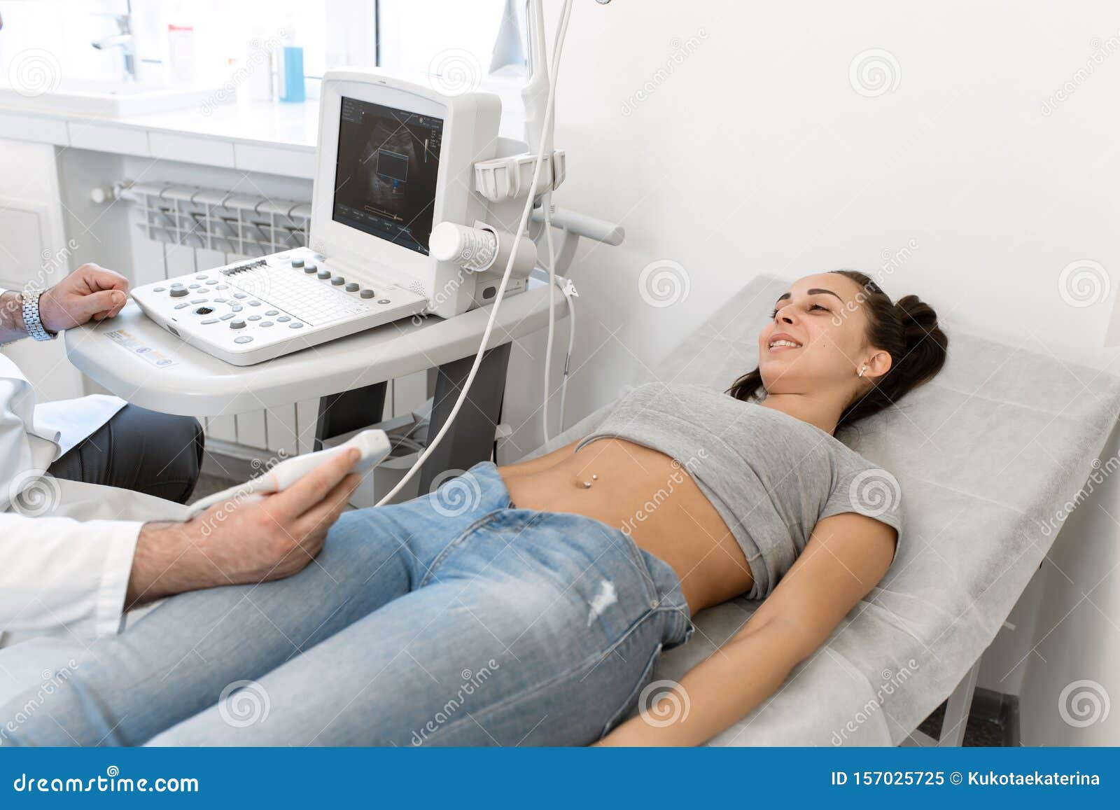 young woman having 4d ultrasound scan. ultrasound imaging,examination of the abdomen