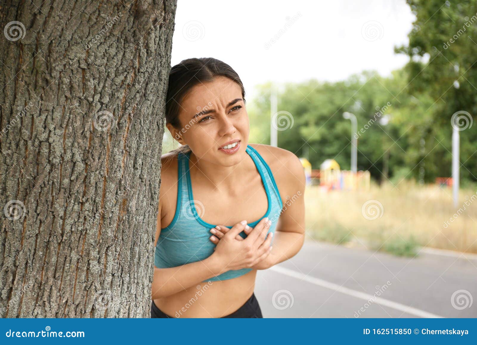 Young Woman Having Heart Attack while Running Stock Photo Image of